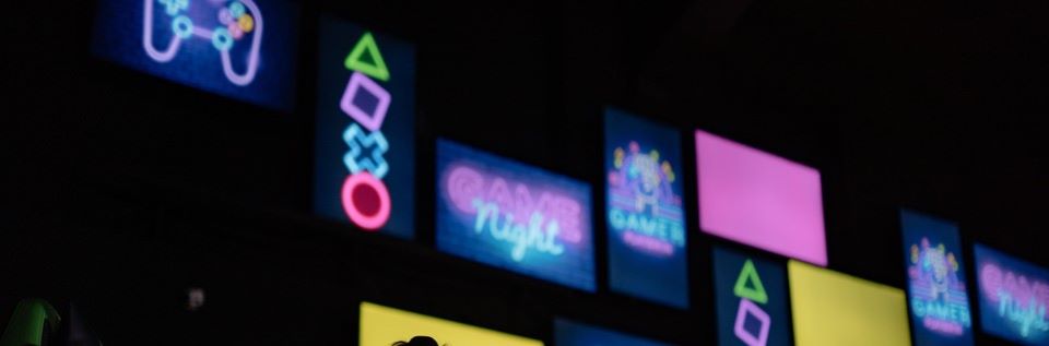 Wall of neon gaming signs